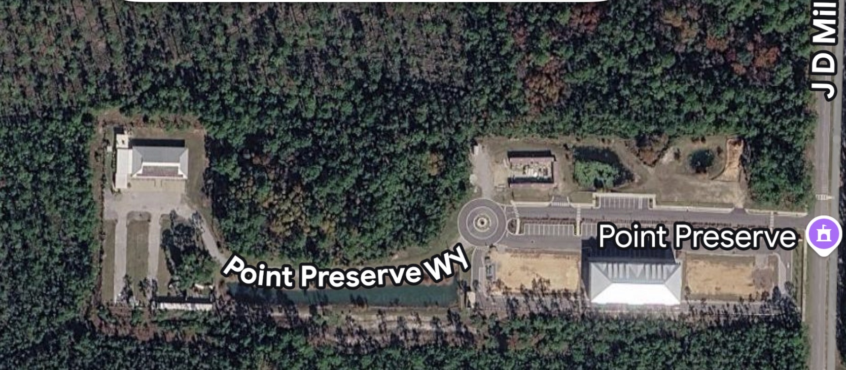 Satellite view of Point Preserve showing the western pavilion, Point Preserve Way, the eastern residence building, and J D Miller Road.